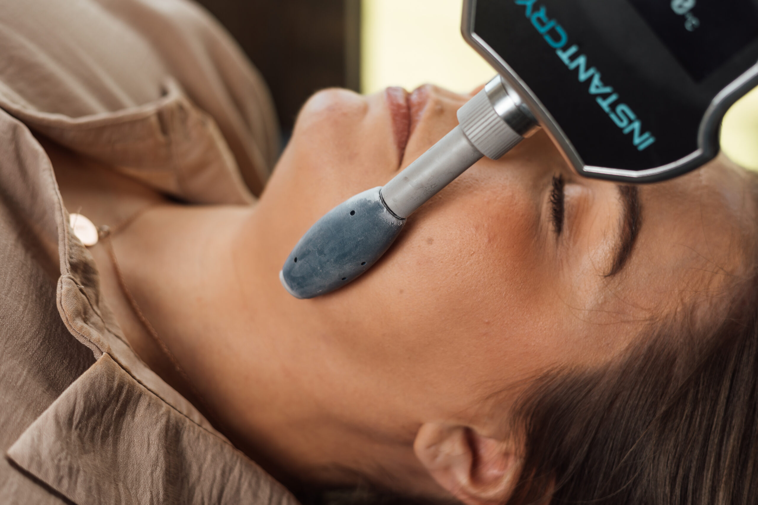 Cryo facial roller being used on a face for a facial